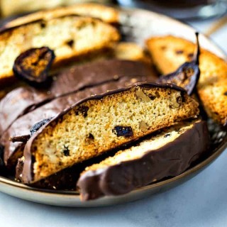 Fig Walnut Chocolate Dipped Biscotti on gold plate