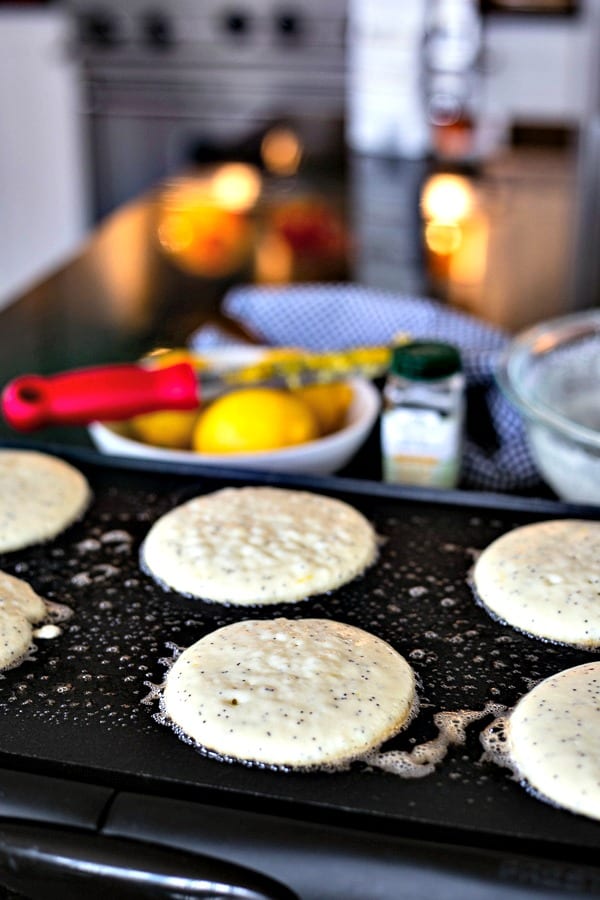 Lemon Poppy Seed pancake batter on a buttered griddle