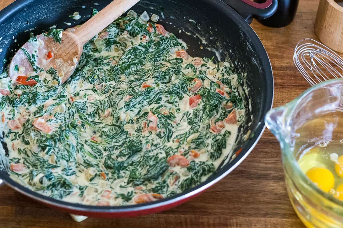 spinach and cheese in a skillet