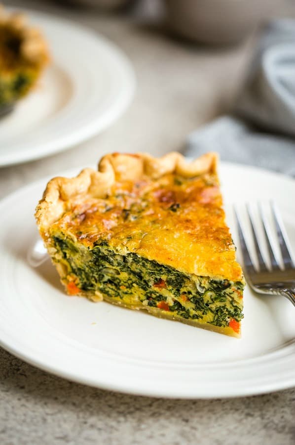 spinache quiche on a white plate