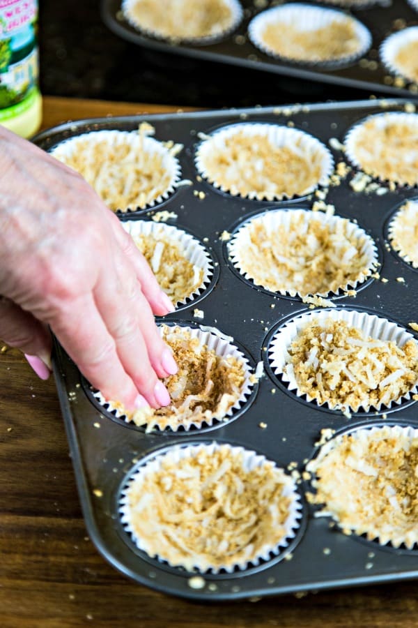 pressing crusts into muffin tin