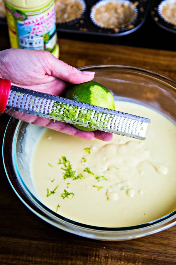 grating lime zest into a bowl