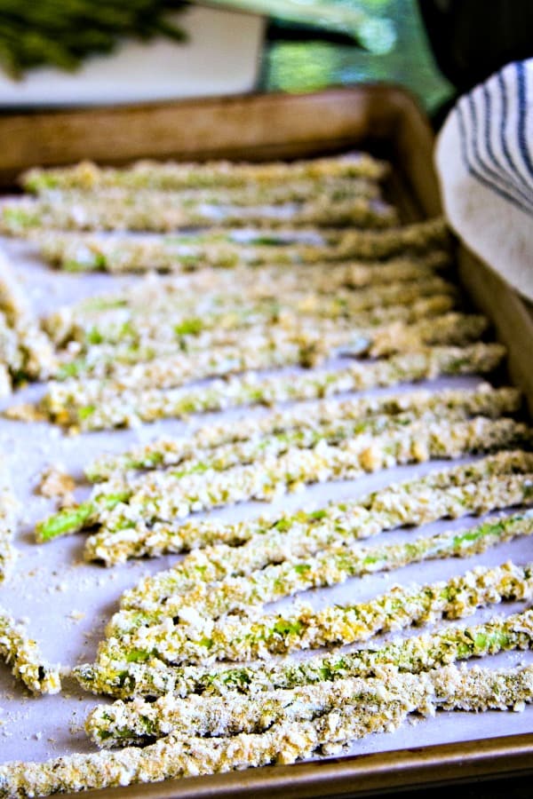 breaded asparagus on parchment paper