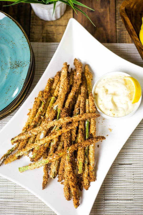Air Fryer Asparagus Fries with Lemon Aioli on white platter