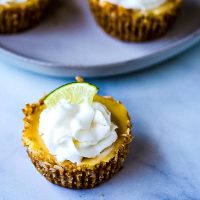 Mini Coconut Key Lime pie with whipped cream and lime slice