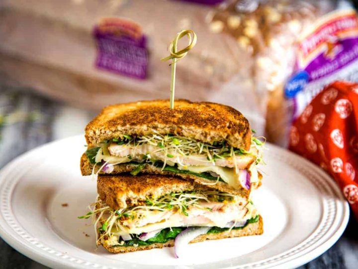 turkey melt sandwich on a white plate