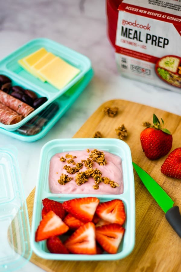 meal prep snack with yogurt and strawberries in a divided container
