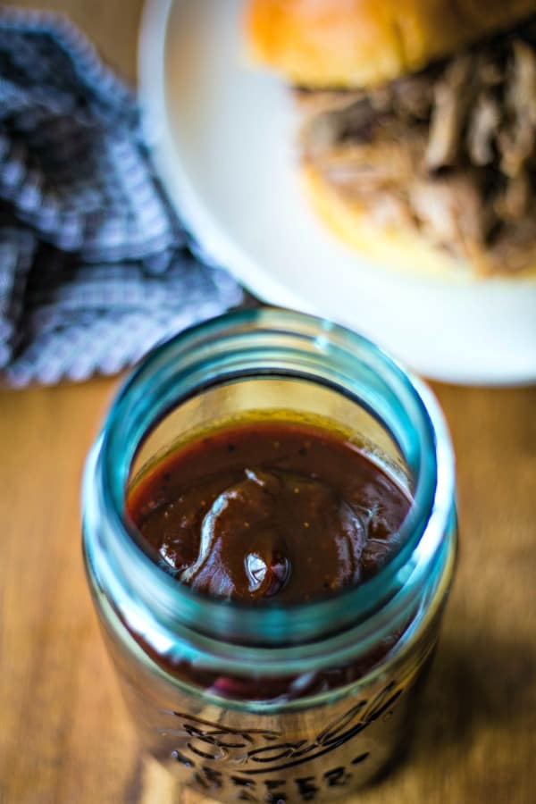 A jar of barbecue sauce on a table