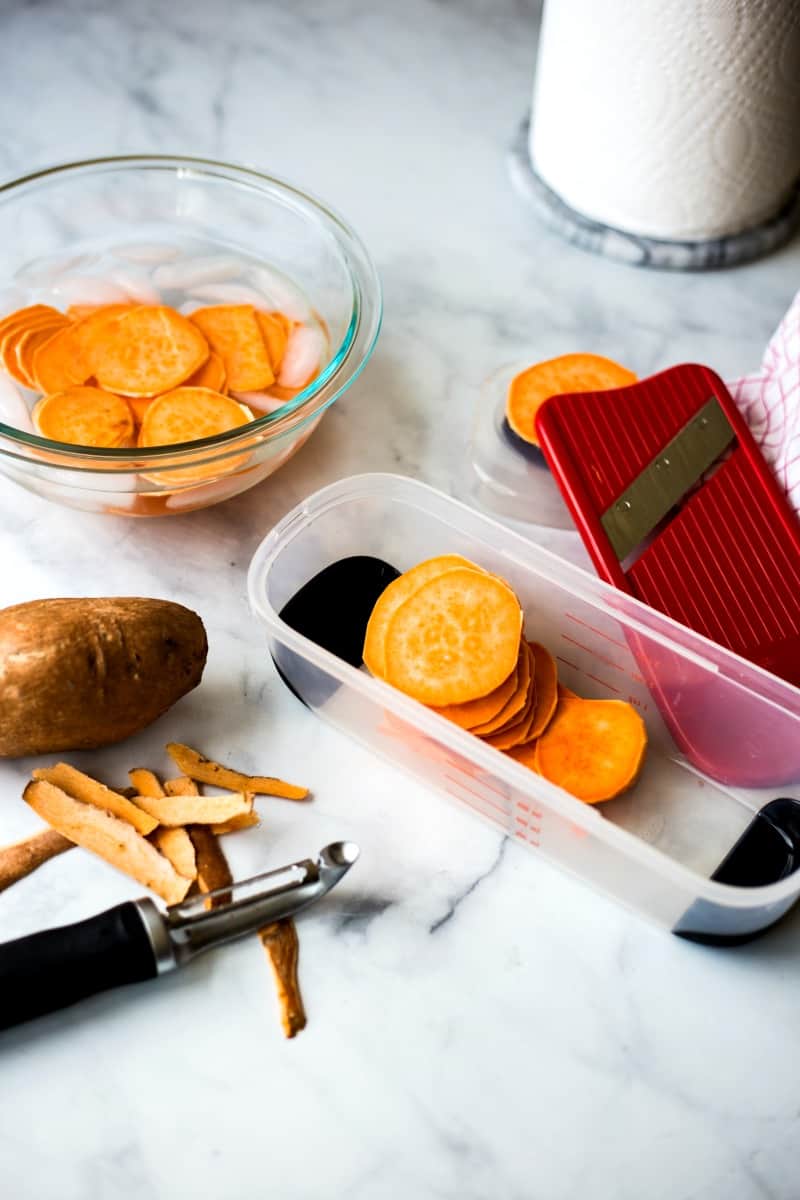 slicing sweet potatoes with a mandoline