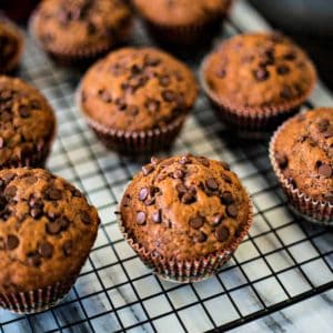 chocolate banana muffins on a wire cooling rack
