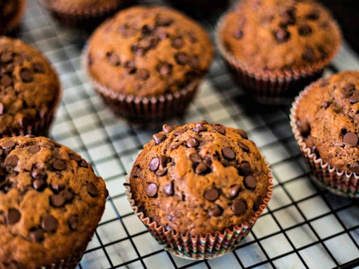 chocolate banana muffins on a wire cooling rack