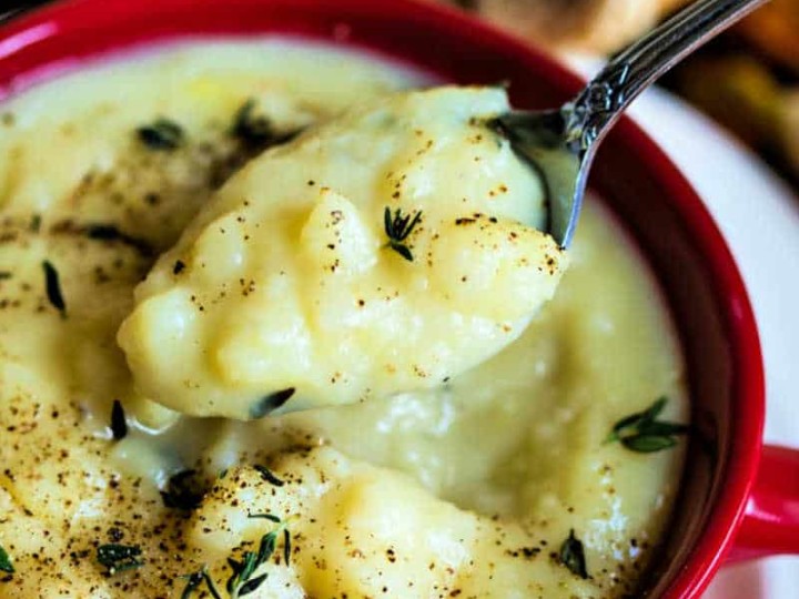 old fashioned potato soup in a red soup mug