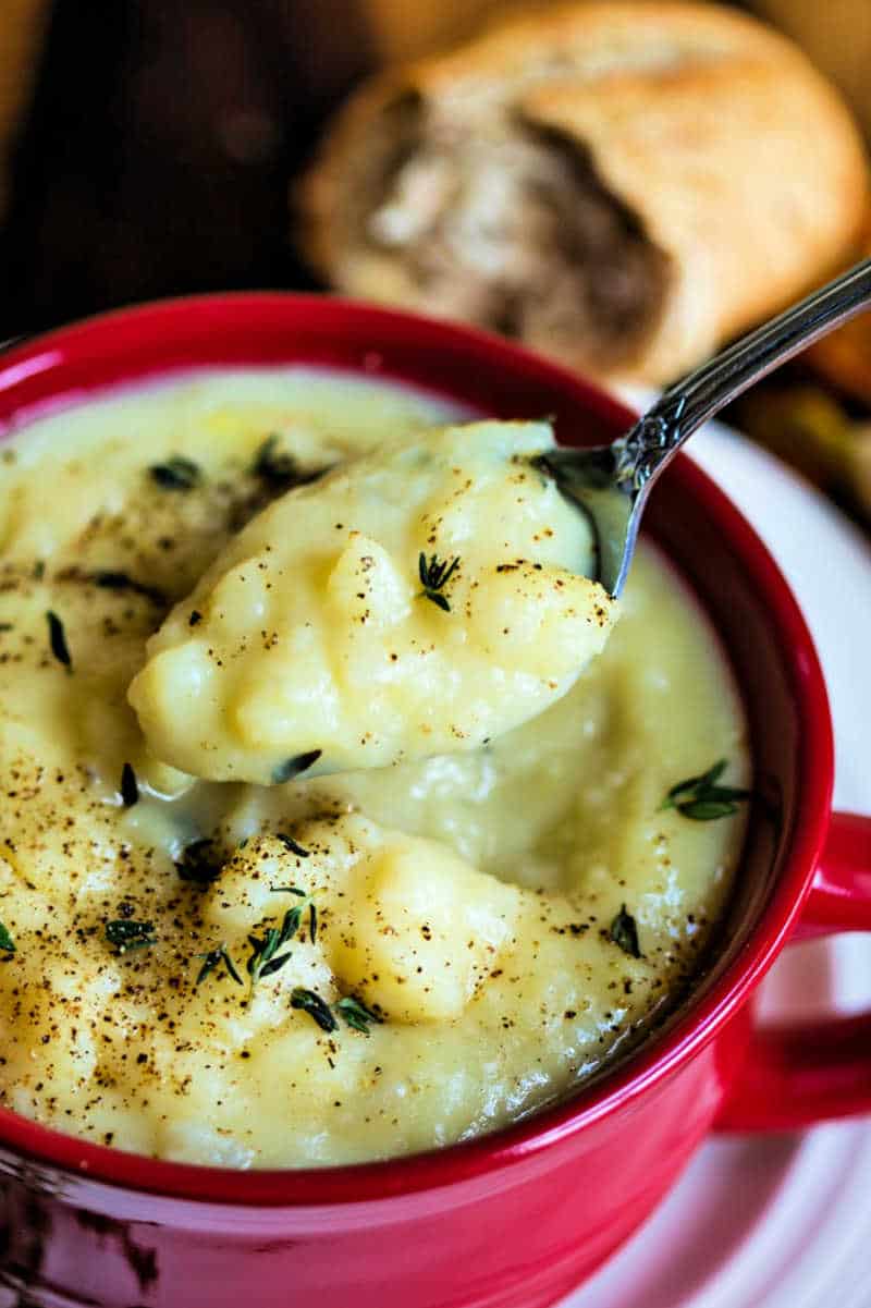 old fashioned potato soup in a red soup mug