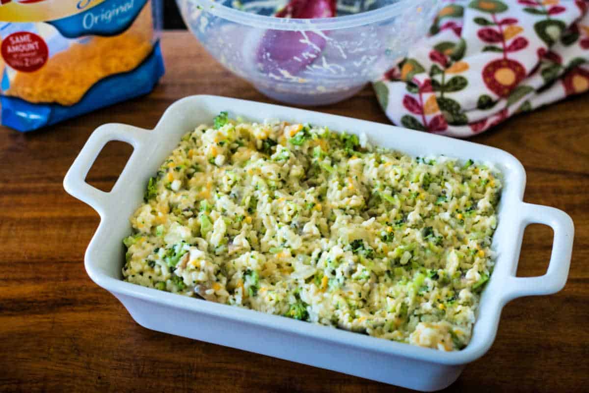 prepping Broccoli Rice and Cheese Casserole for the oven