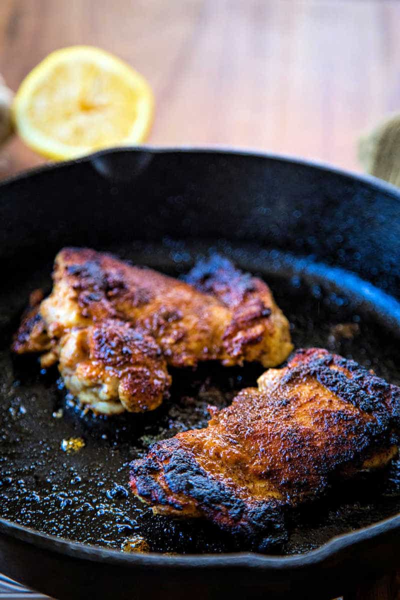 blackened chicken thighs in cast iron skillet