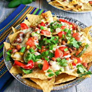 vegetarian nachos with pinto beans, peppers, and cheese sauce