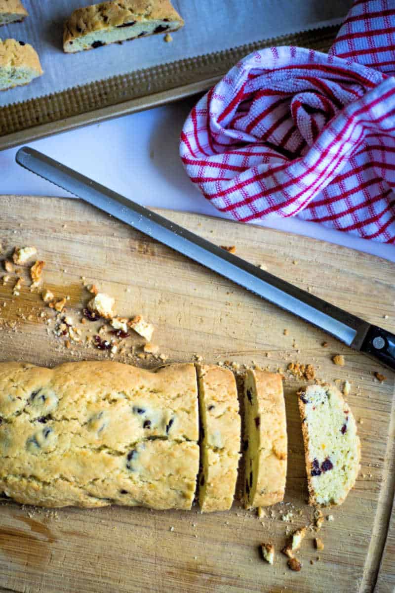 slicing cherry biscotti with a serrated knife