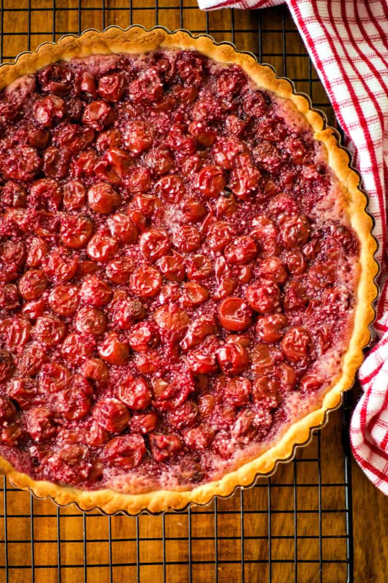 sour cherry tart on a wire rack