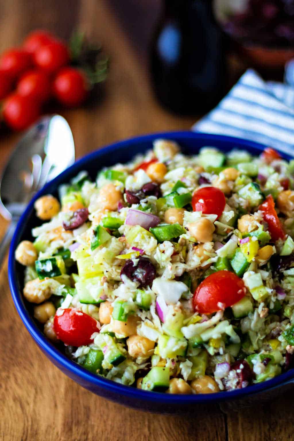 healthy greek coleslaw in a blue bowl