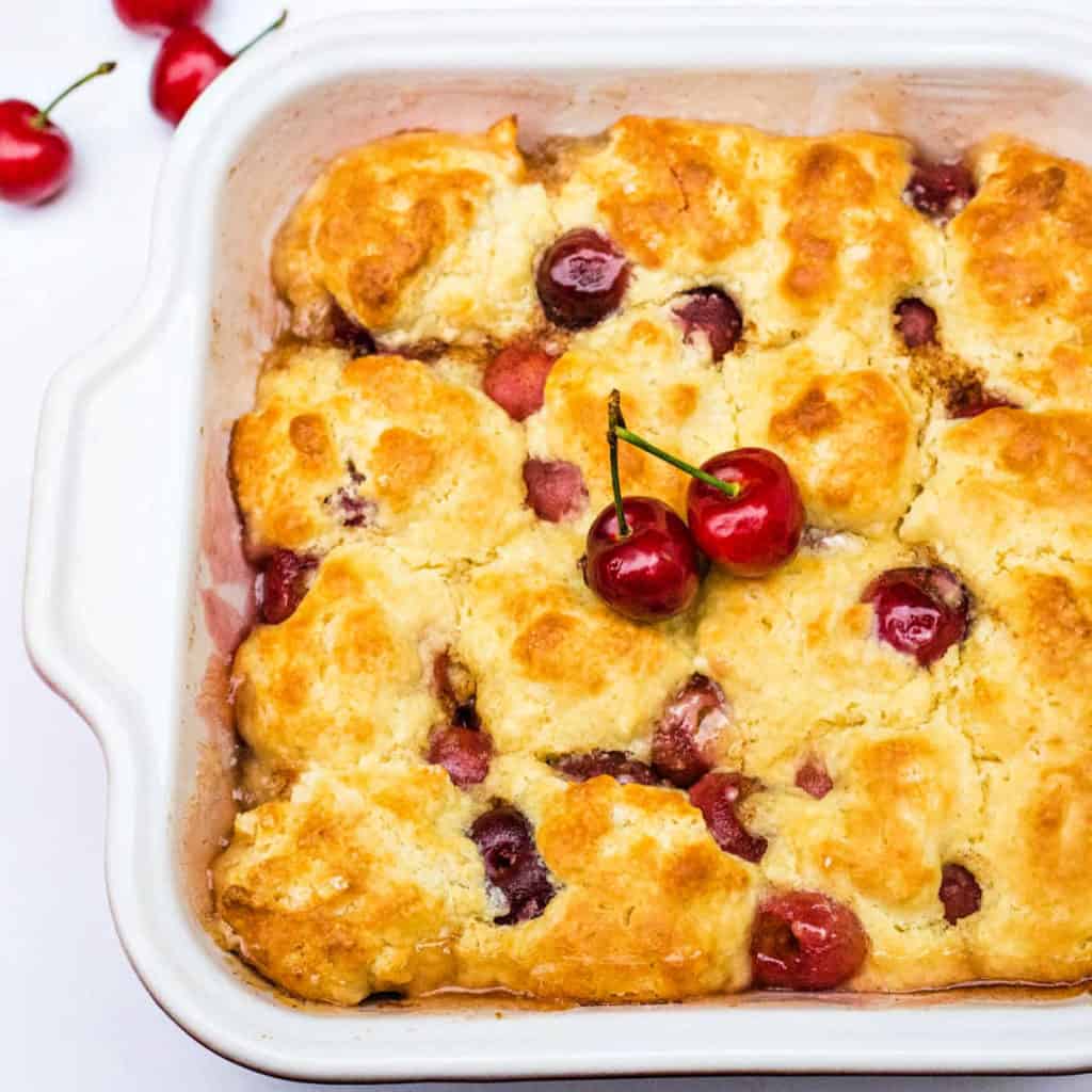 peach cherry cobbler in a baking dish fresh from the oven