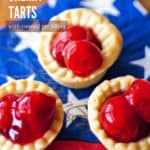 3 bite size cherry tarts on a patriotic napkin