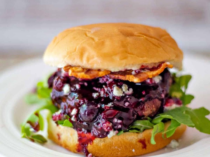 Blueberry Blue Cheese Bacon Burger on a white plate