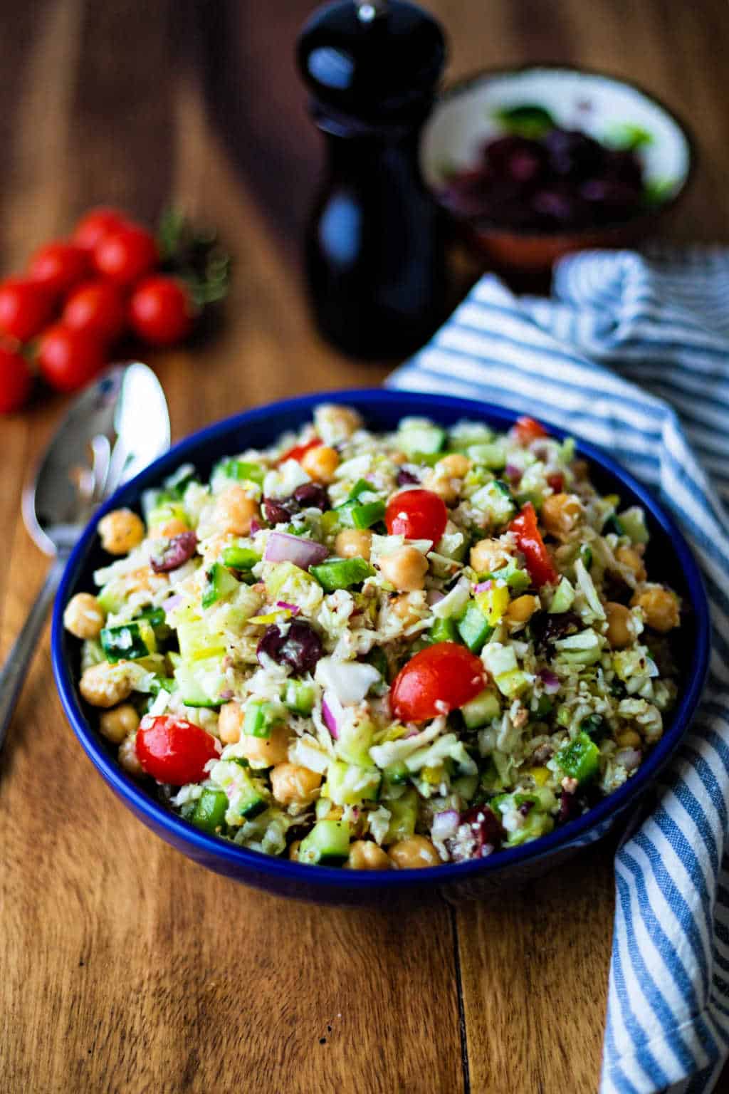 healthy greek coleslaw in a blue bowl