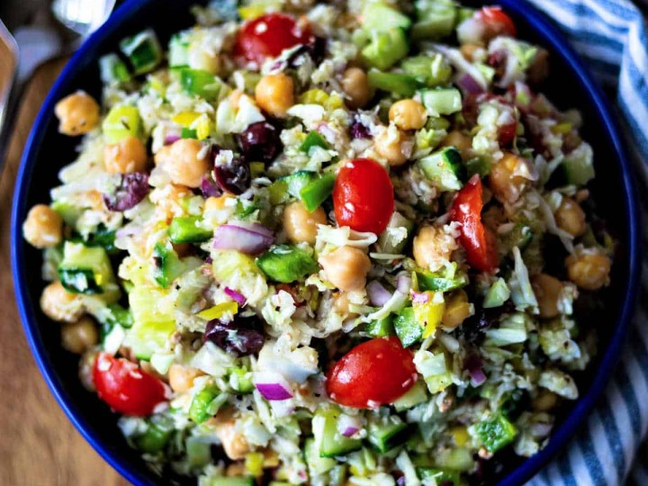 healthy greek coleslaw in a blue bowl