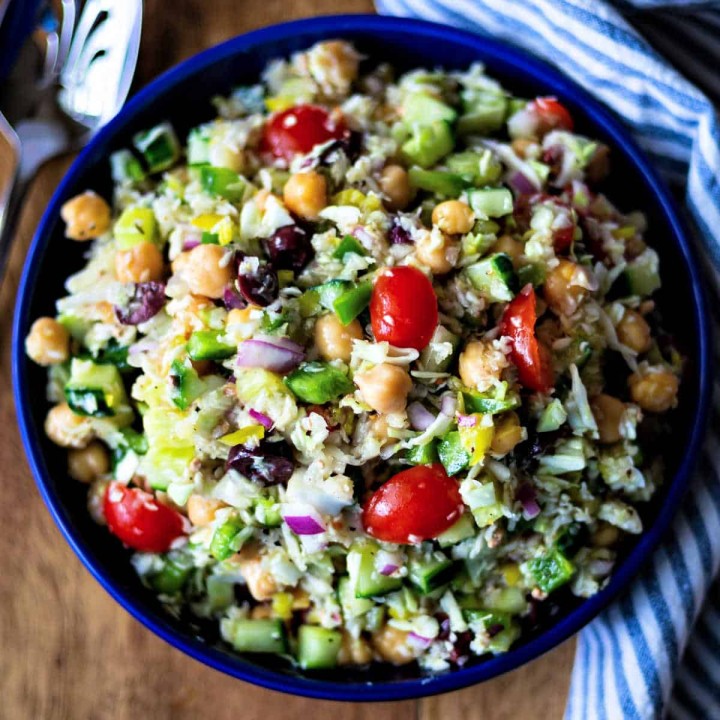 healthy greek coleslaw in a blue bowl