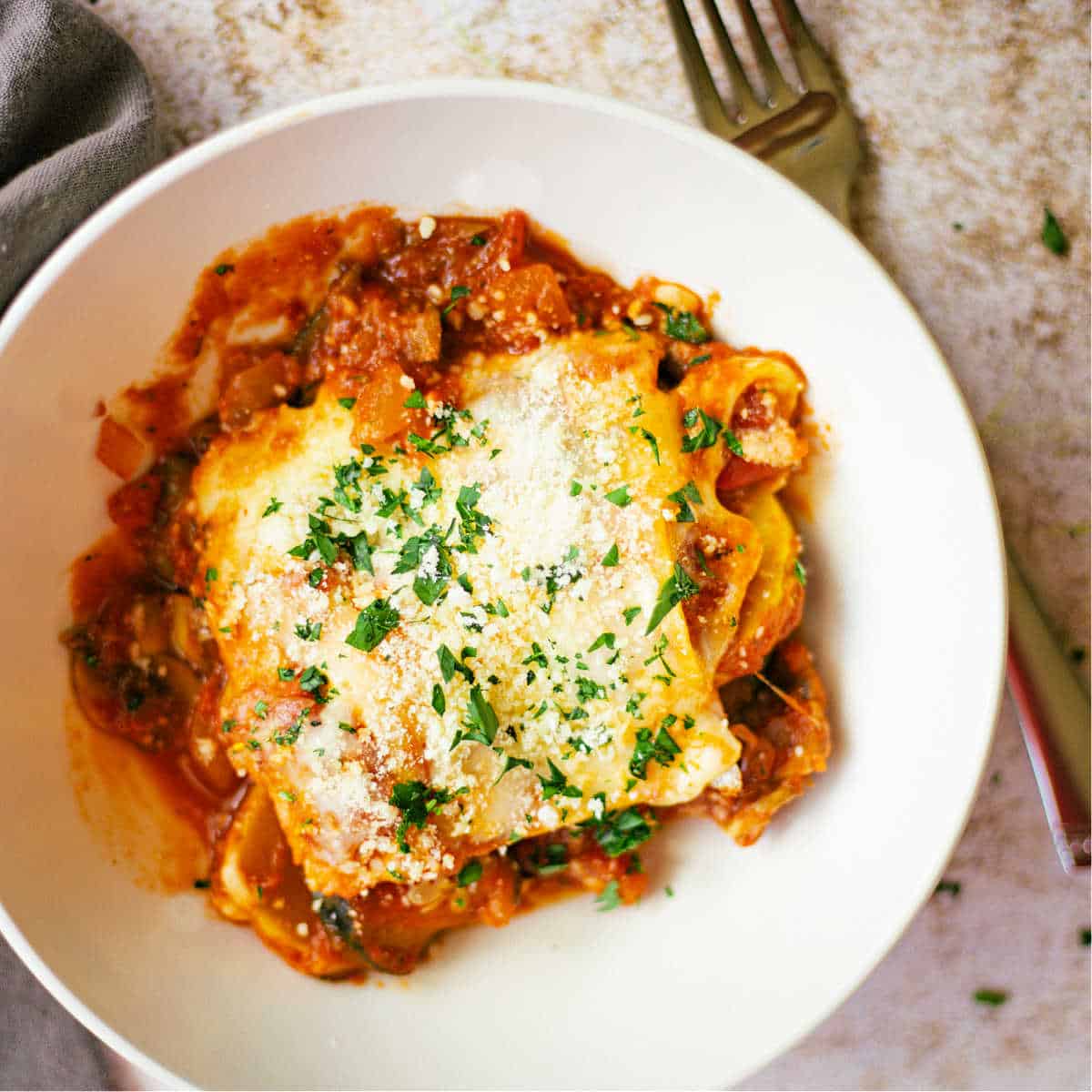 Skillet Lasagna with Squash and Mushrooms in a white bowl