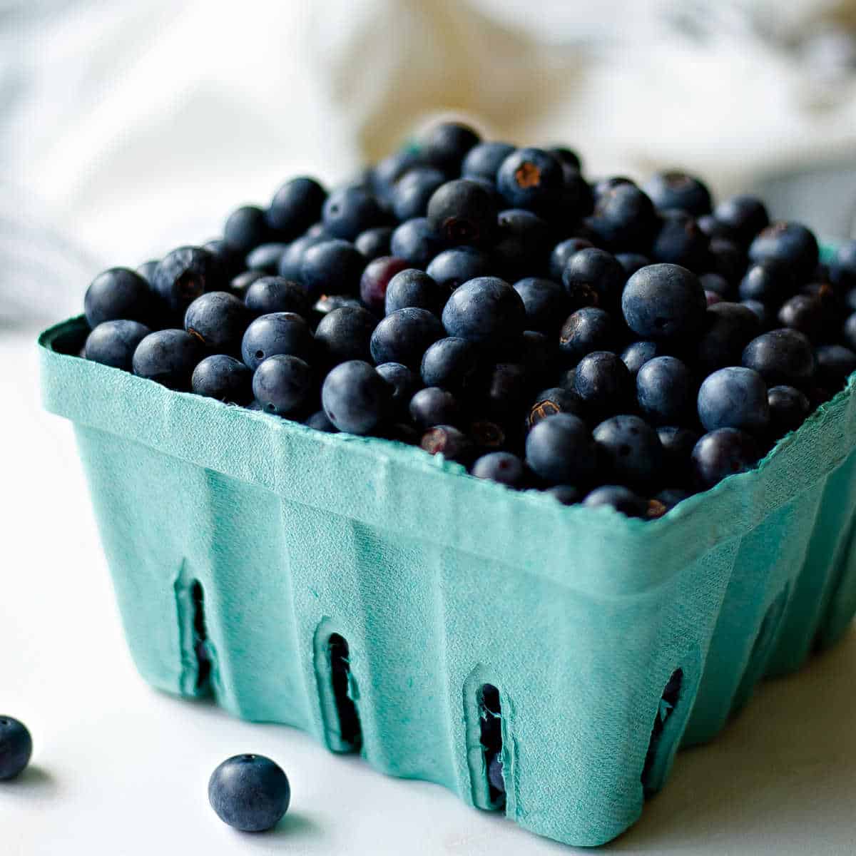 fresh blueberries in a cardboard crate