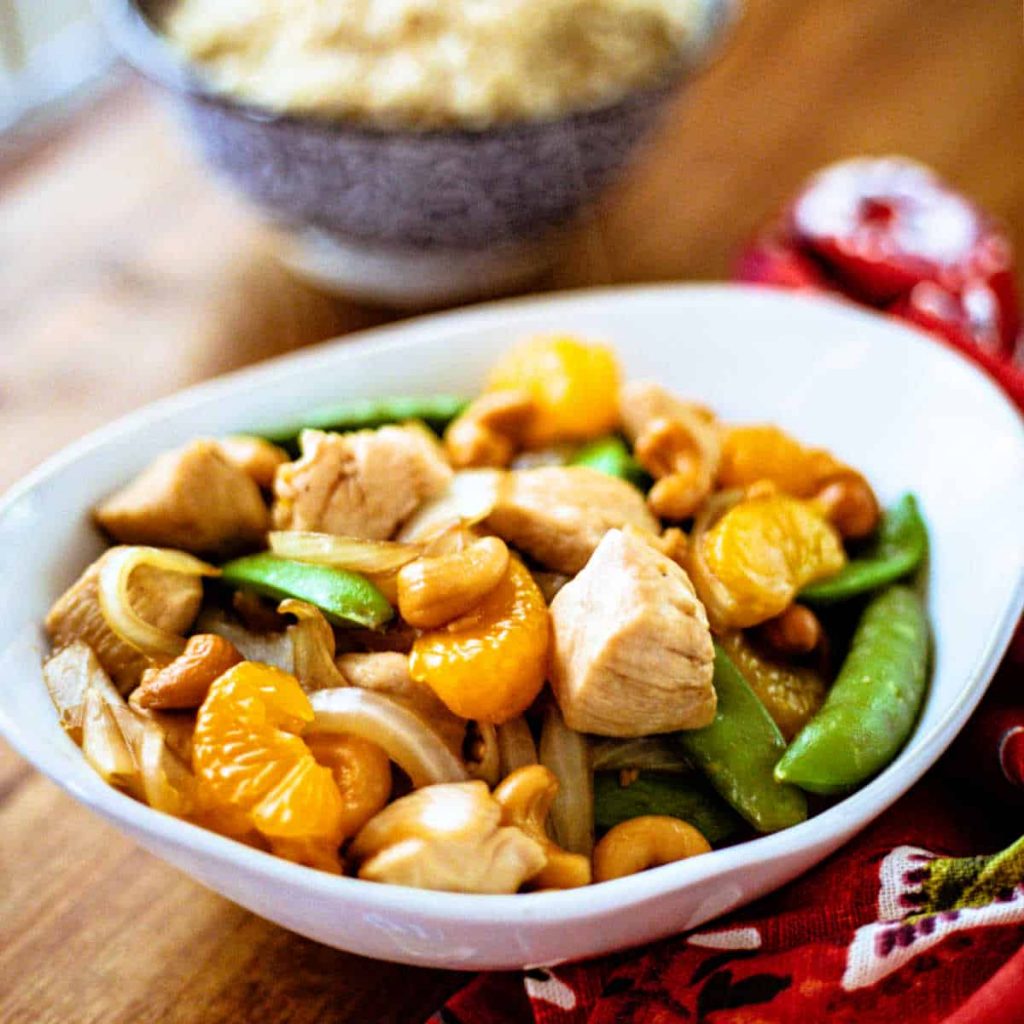 Easy Orange Cashew Chicken with a bowl of rice