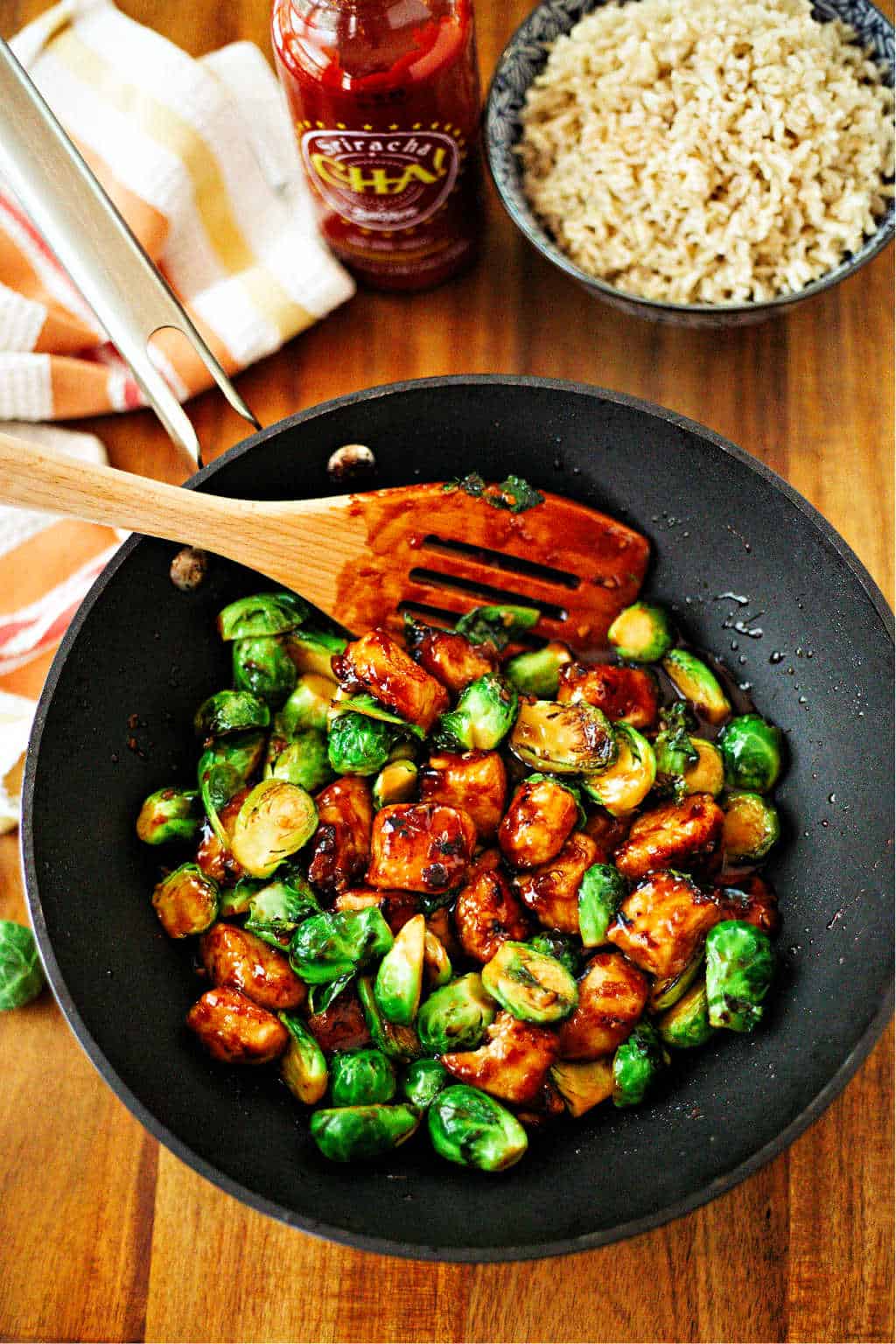 Sriracha Chicken and Brussels Sprouts Stir Fry in a wok