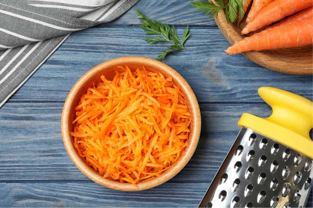 a bowl of grated carrots