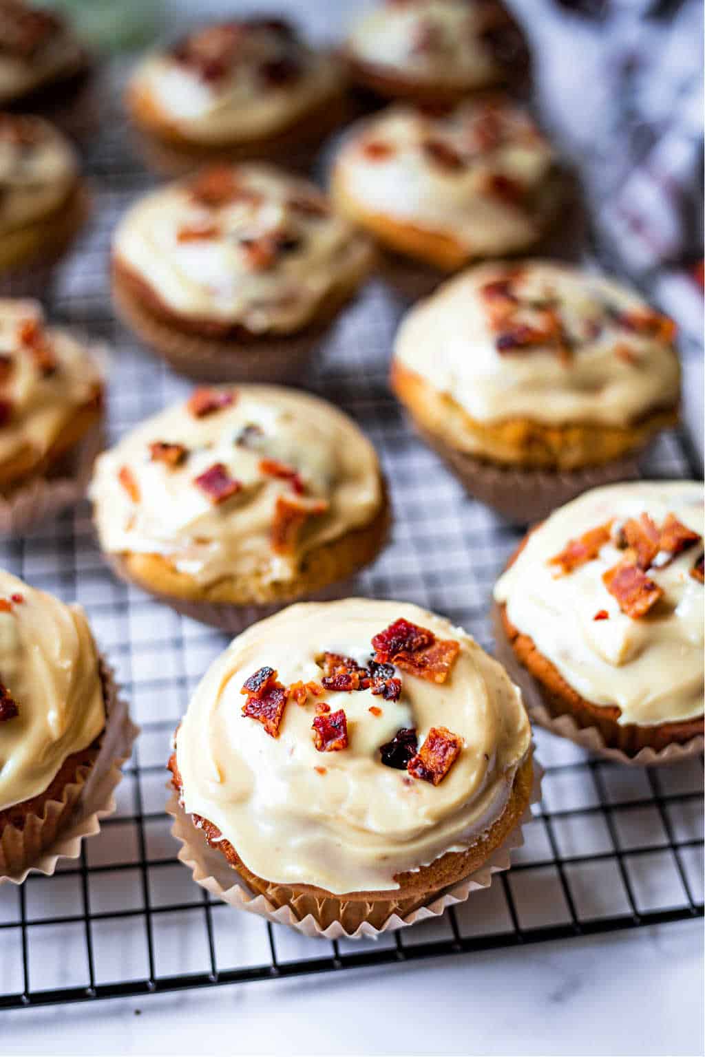 maple glazed bacon muffins on a wire rack