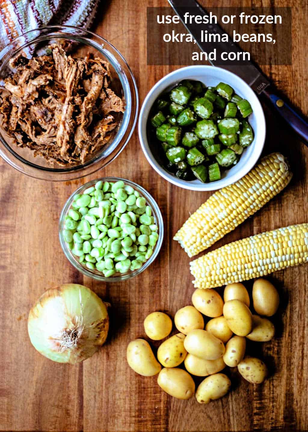 ingredients for Brunswick Stew on a wooden table