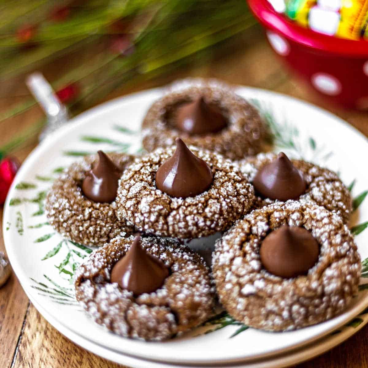 Close up of a plate of Gingerbread Kiss Cookies on a wooden table