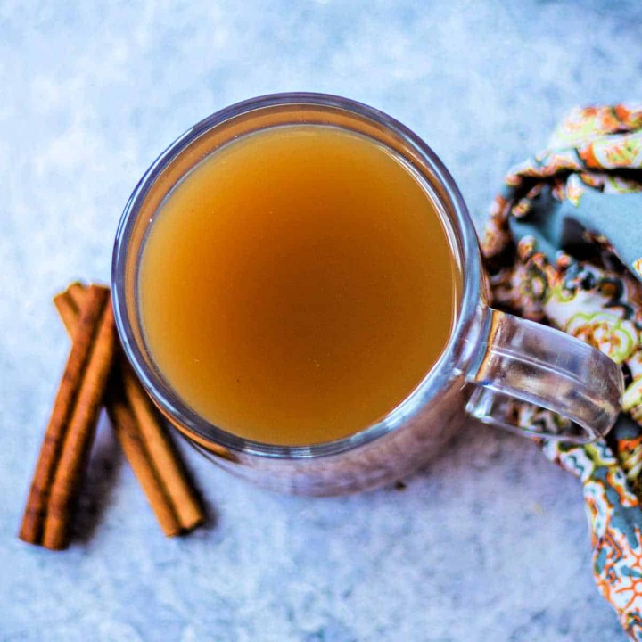 hot apple cider in a glass mug