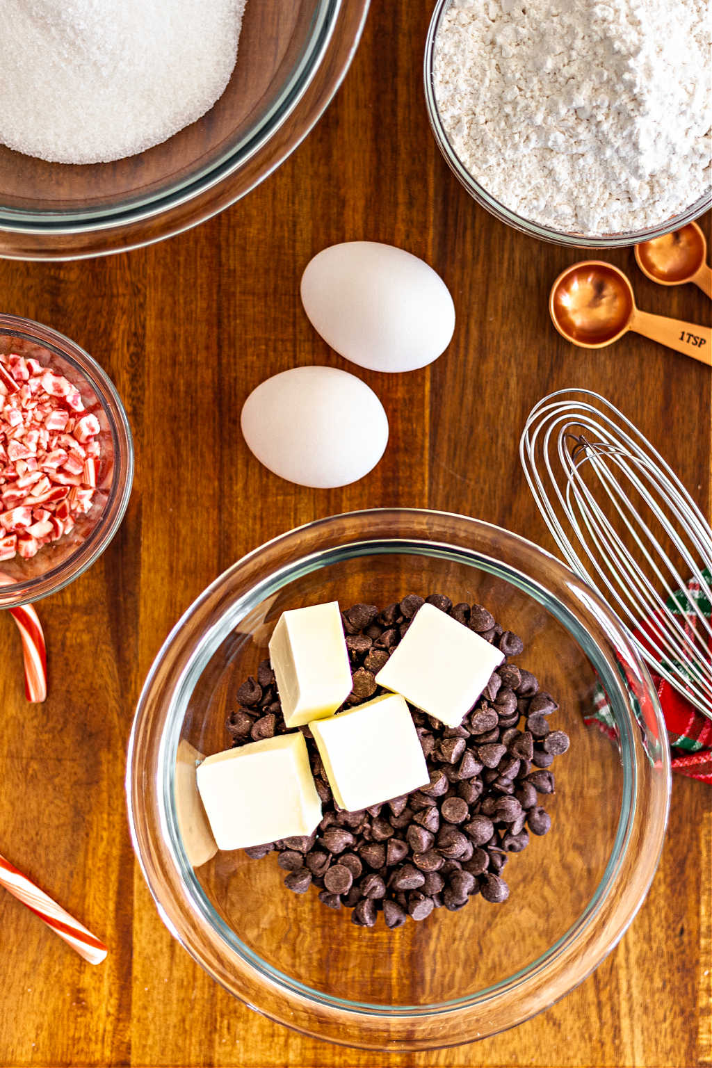 ingredients for peppermint brownie cookies on a wooden table