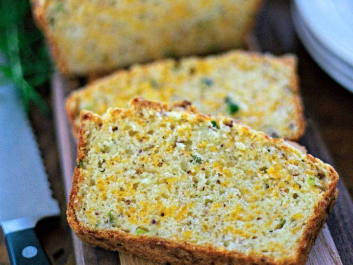 cheese bread loaf slices on a wooden board