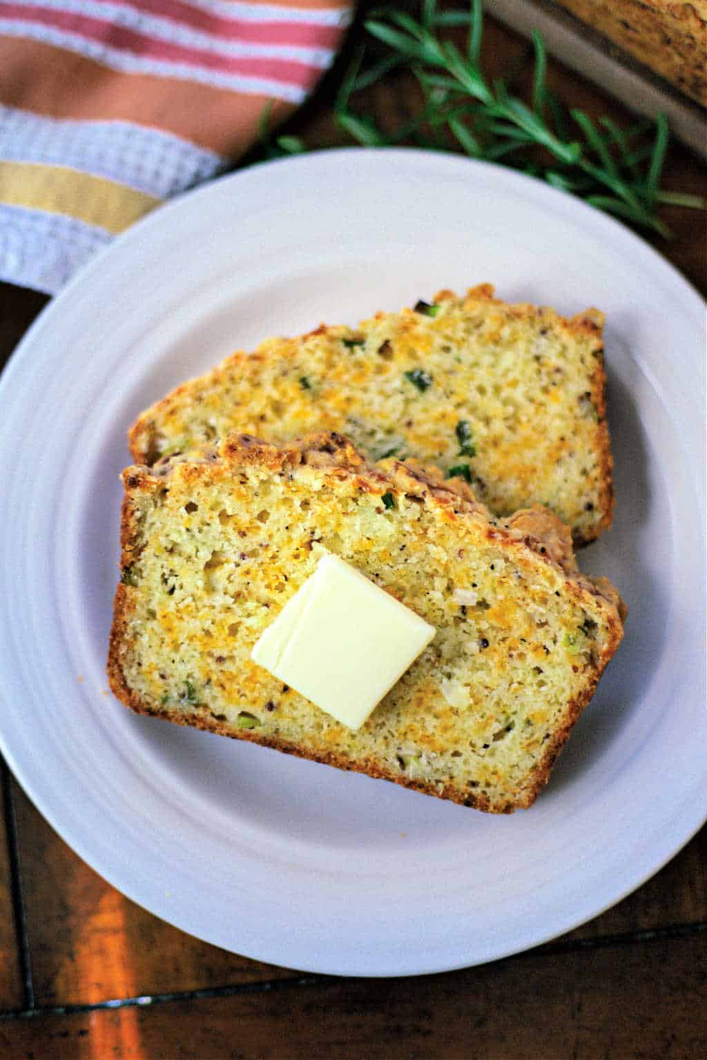 cheese bread loaf slices on a white plate