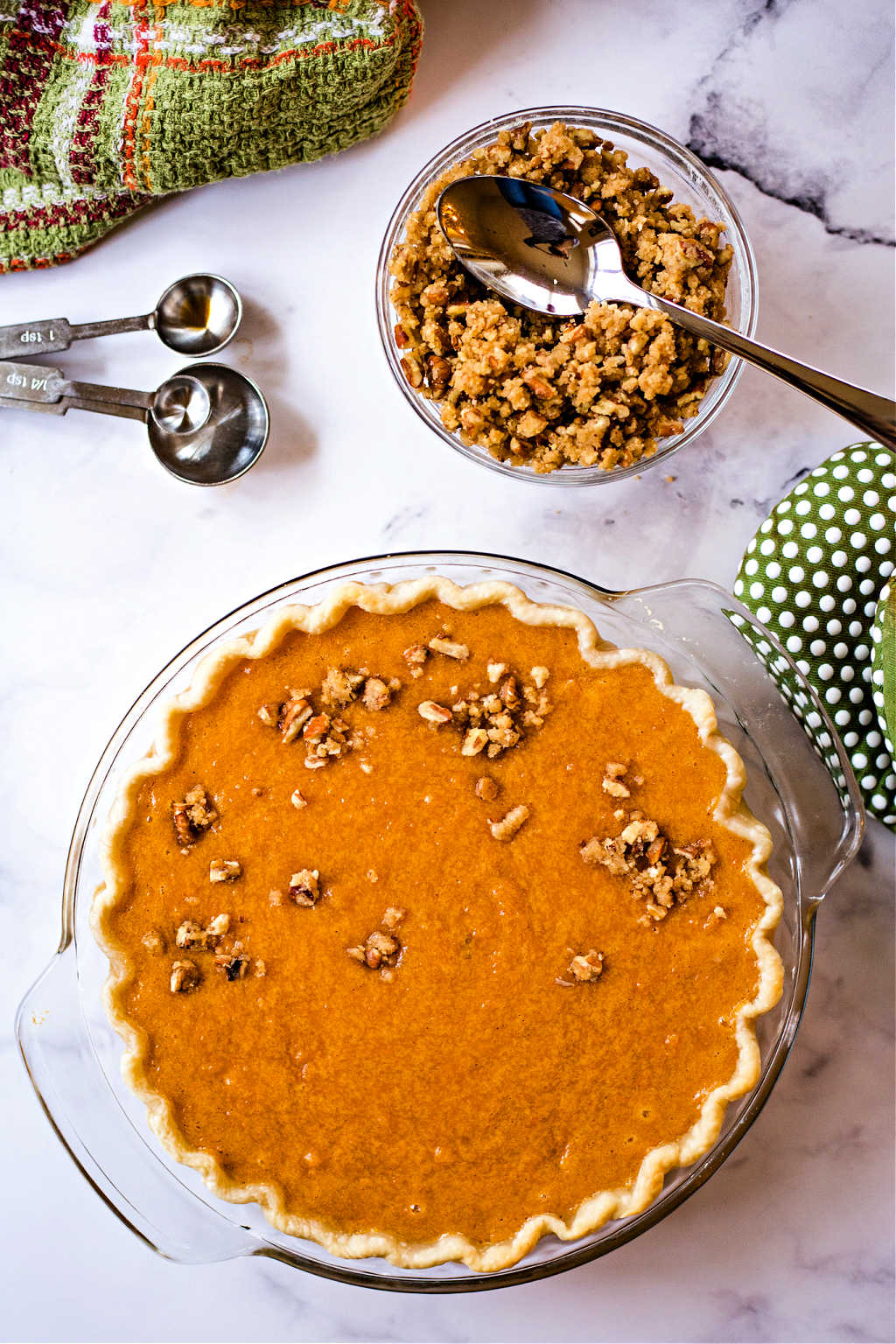 adding streusel on top of an unbaked sweet potato pie