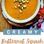 Creamy Butternut Squash and Sweet Potato Soup in a bowl with pumpkin seeds.