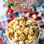 Nutty Caramel Corn in a white bowl on a Christmas plaid tablecloth