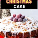 Cranberry Christmas Cake, on a cake stand on a table.