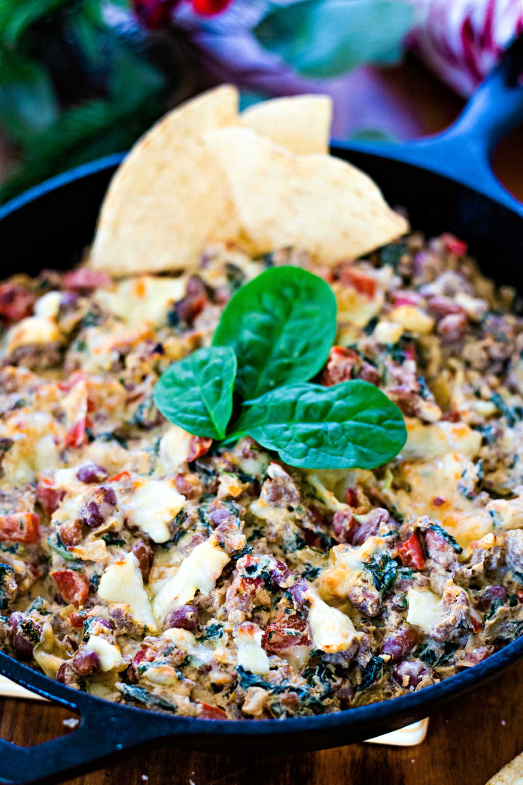 Sausage, Bean, and Spinach Dip in a cast iron skillet