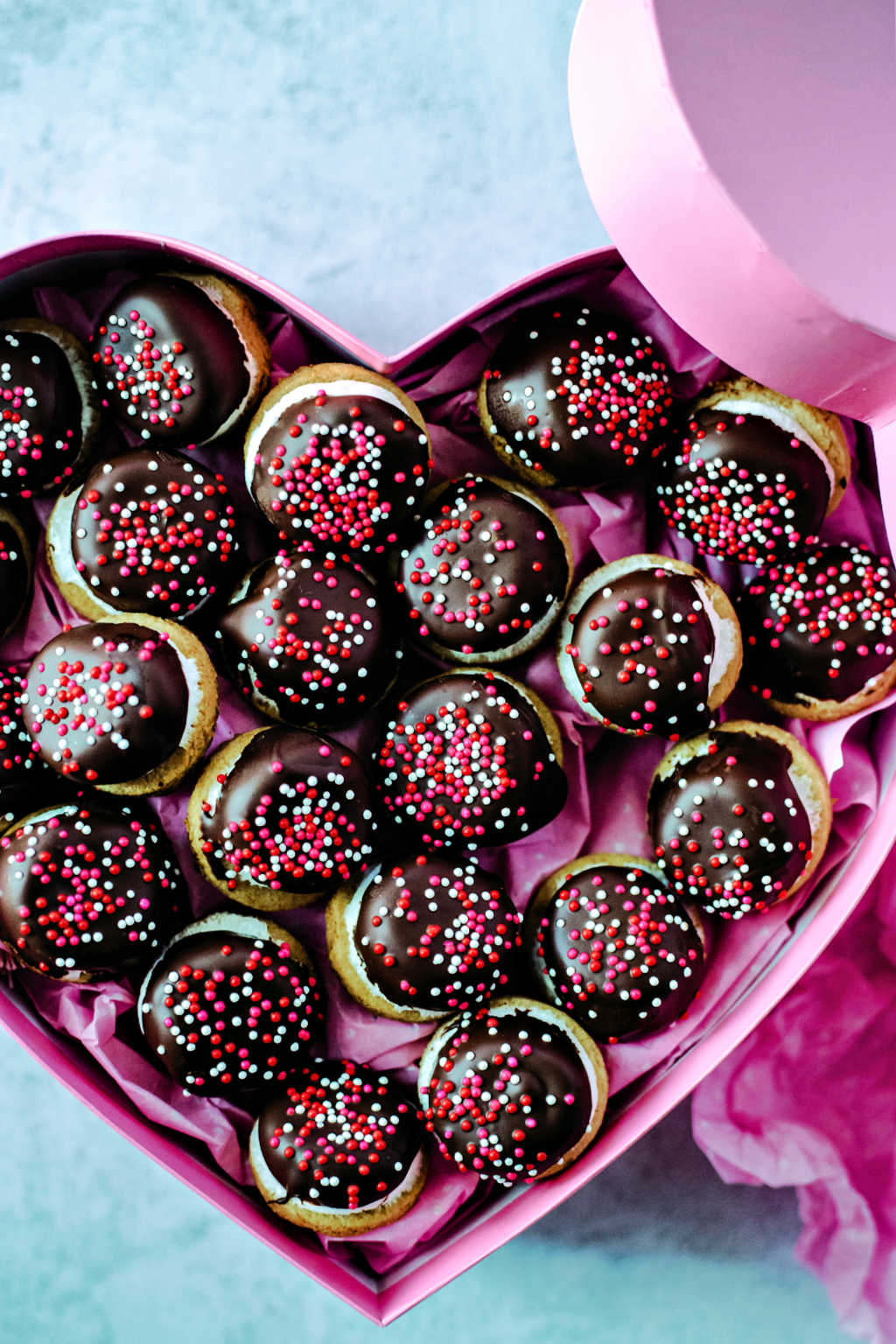 chocolate marshmallow cookies in a pink heart shaped box