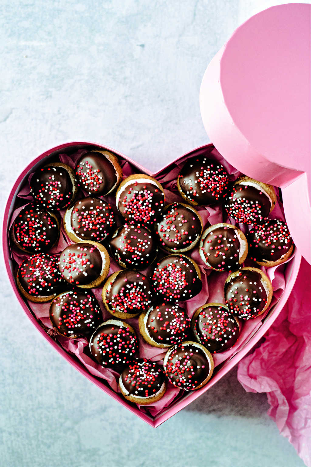 chocolate marshmallow cookies in a pink heart shaped box