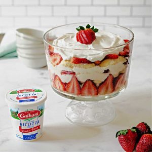 a strawberry trifle on a kitchen counter.