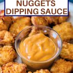 a cup of dipping sauce in the middle of a plate of Chick-fil-A Chicken Nuggets